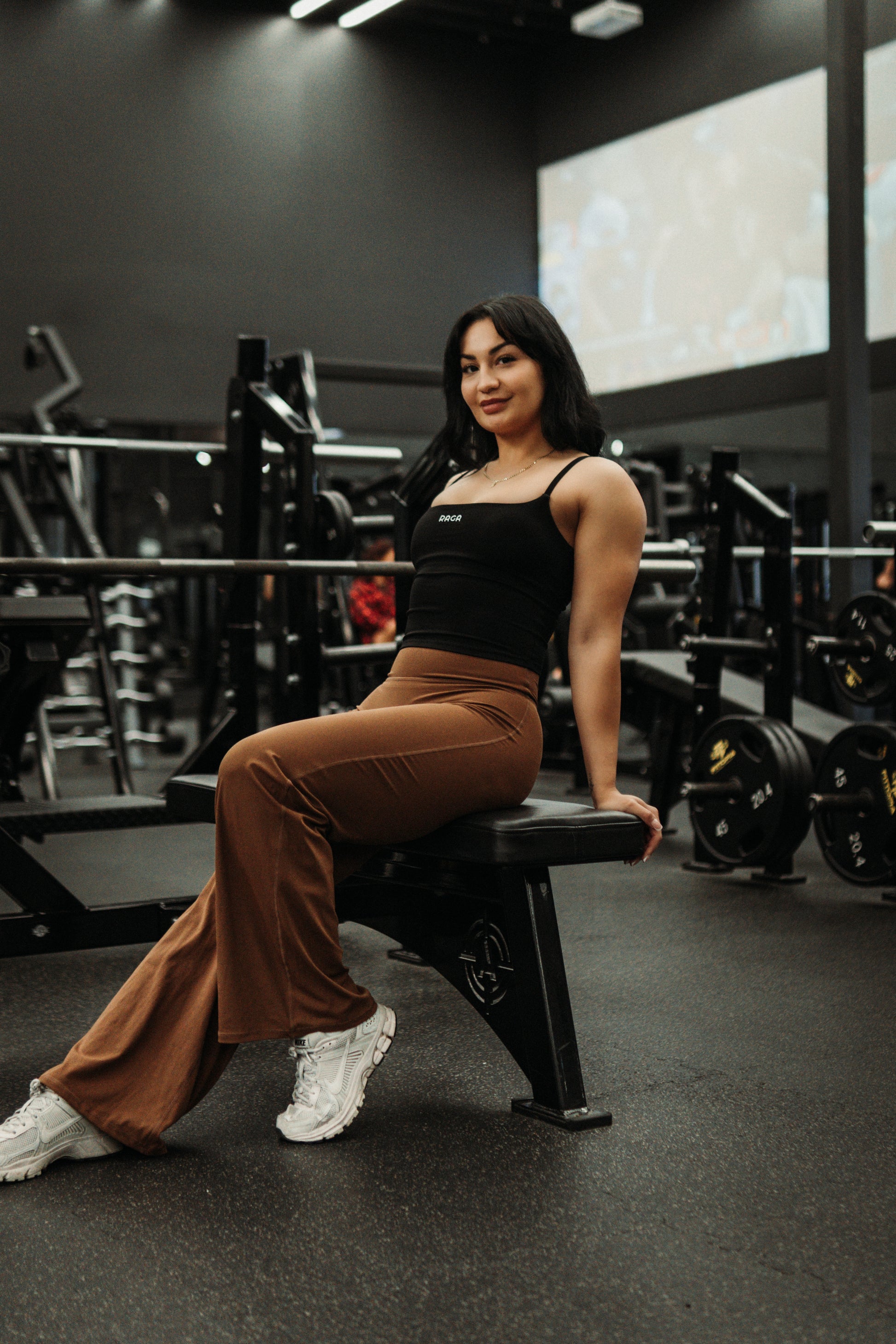 RAGA black seamless tank top paired with brown Effort flare leggings.