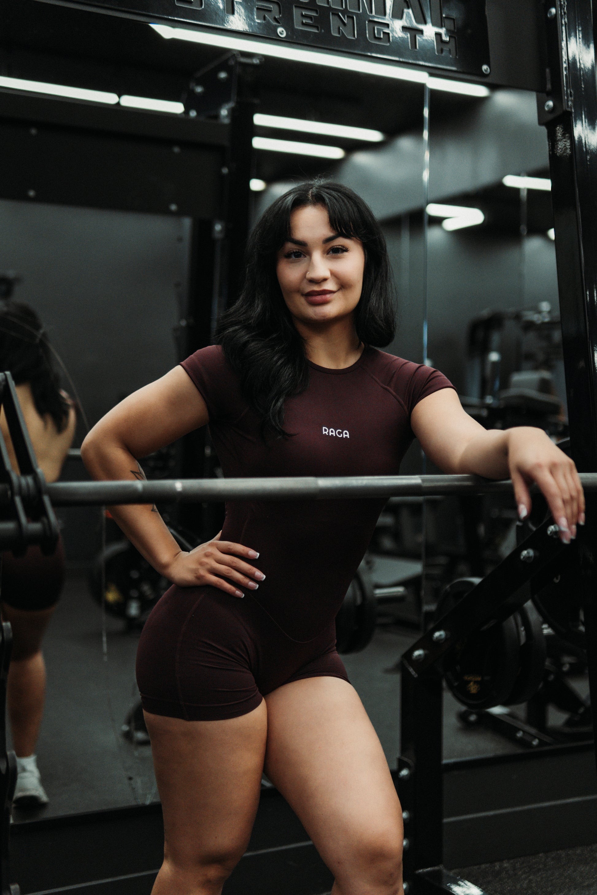 Brown RAGA EFFORT one-piece gym bodysuit featuring a flattering body-hugging fit and contouring design for workouts and everyday wear.