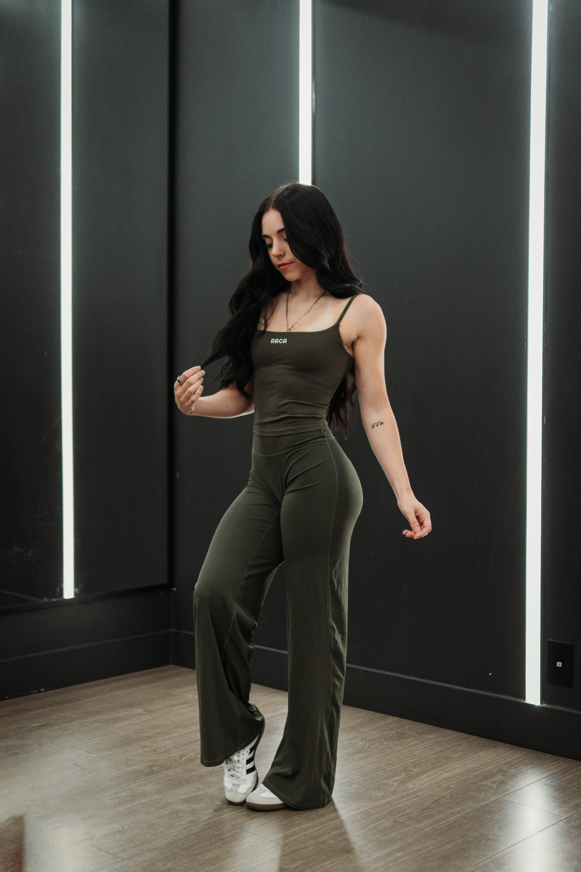 RAGA women's olive green flare leggings with a flattering sculpting fit, supportive waistband, and flared leg design for workouts and everyday wear.