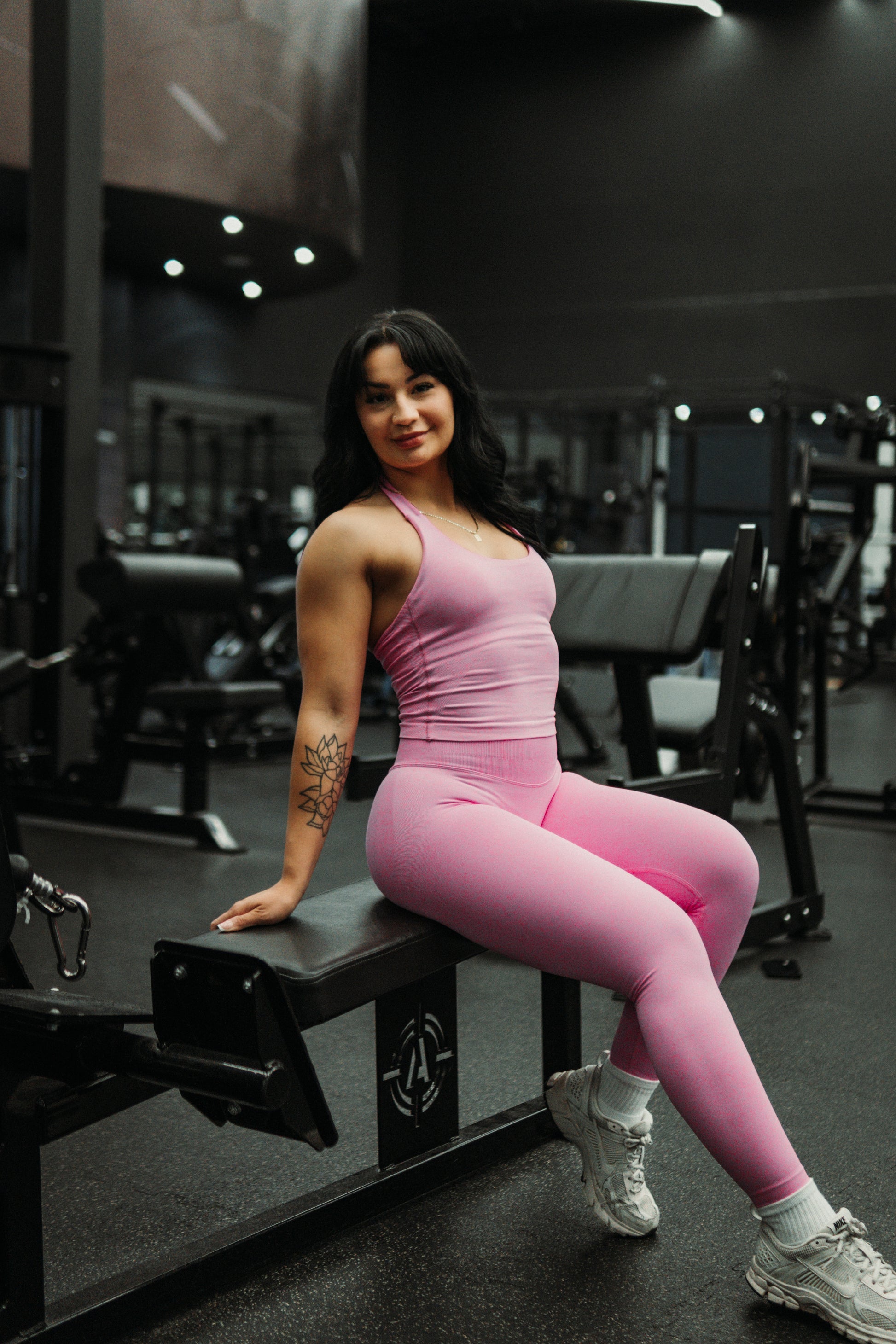 Pink seamless workout leggings for women featuring a sculpting fit, scrunch back detail, and flexible stretch fabric.